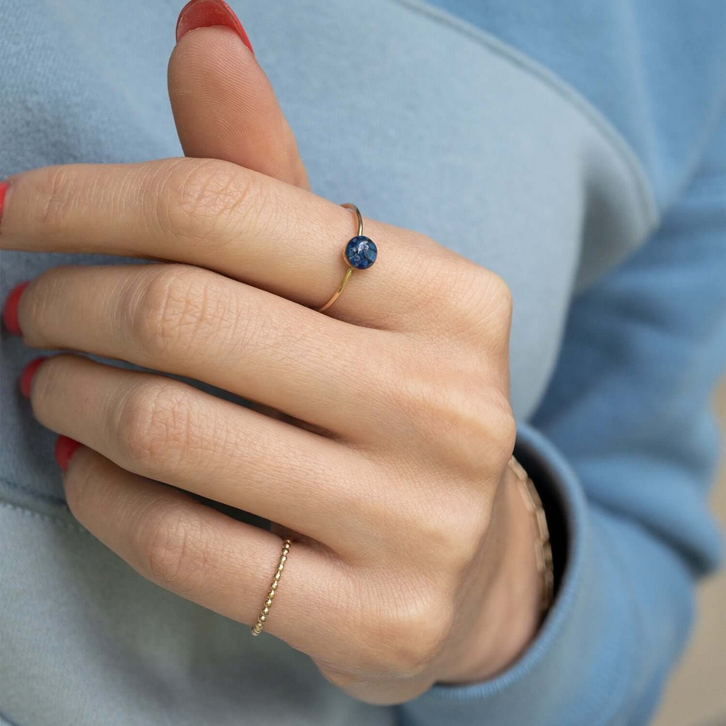 Dainty adorable rings with tiny real Lapis Lazuli stone pieces captured in glass like resin.