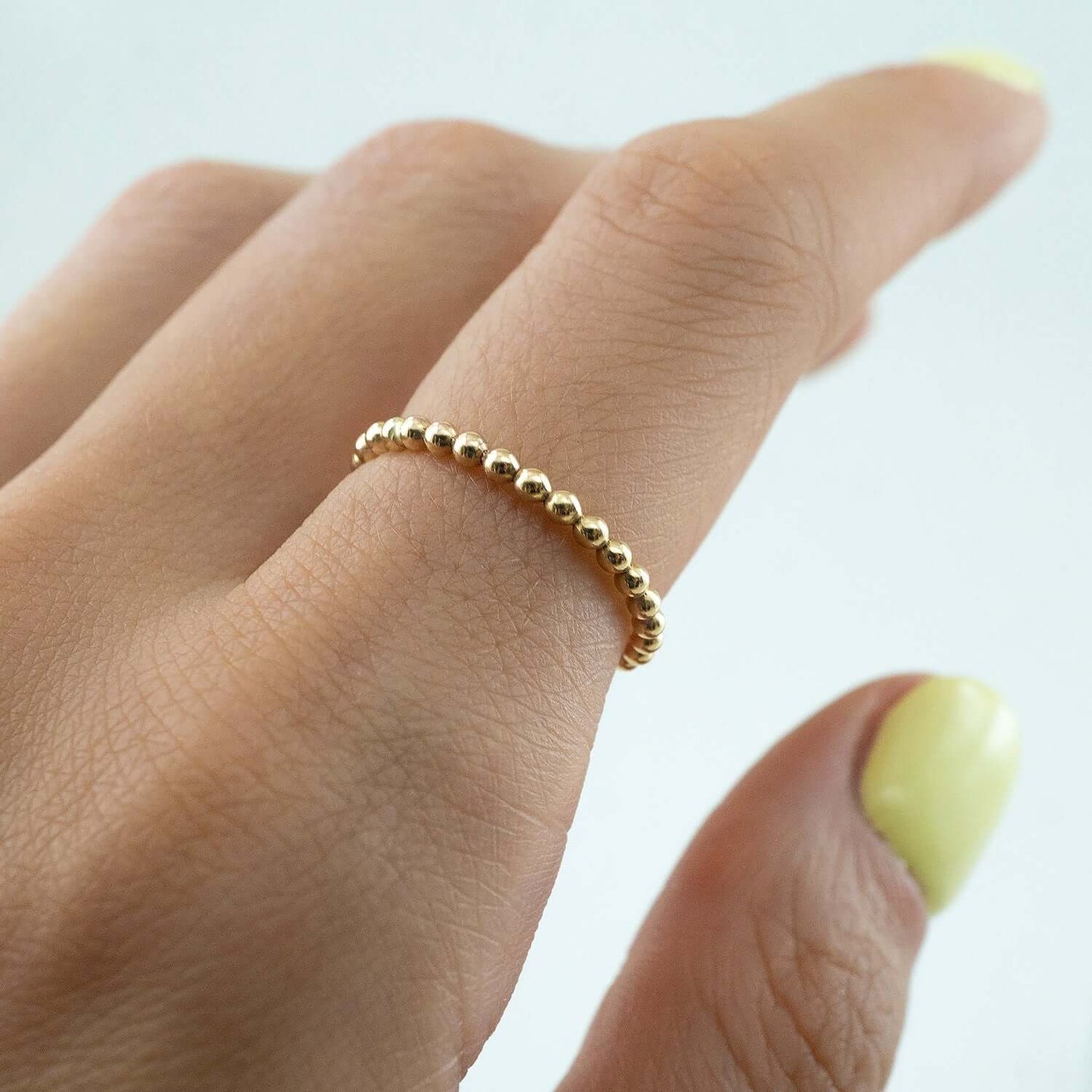 A gold-filled or sterling silver bubble ring with a thick band and textured surface, presented against a white background.