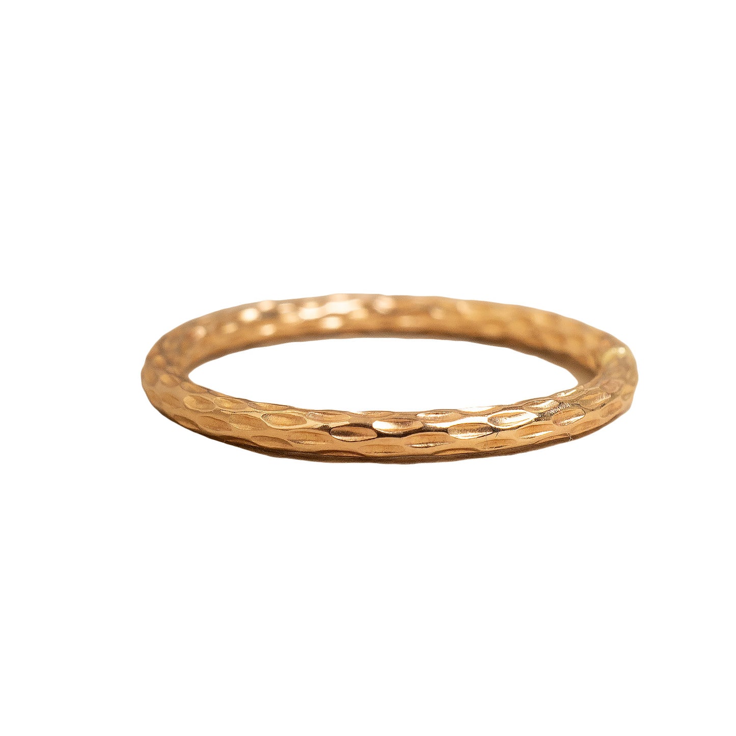Gold ring with a textured band on a white background