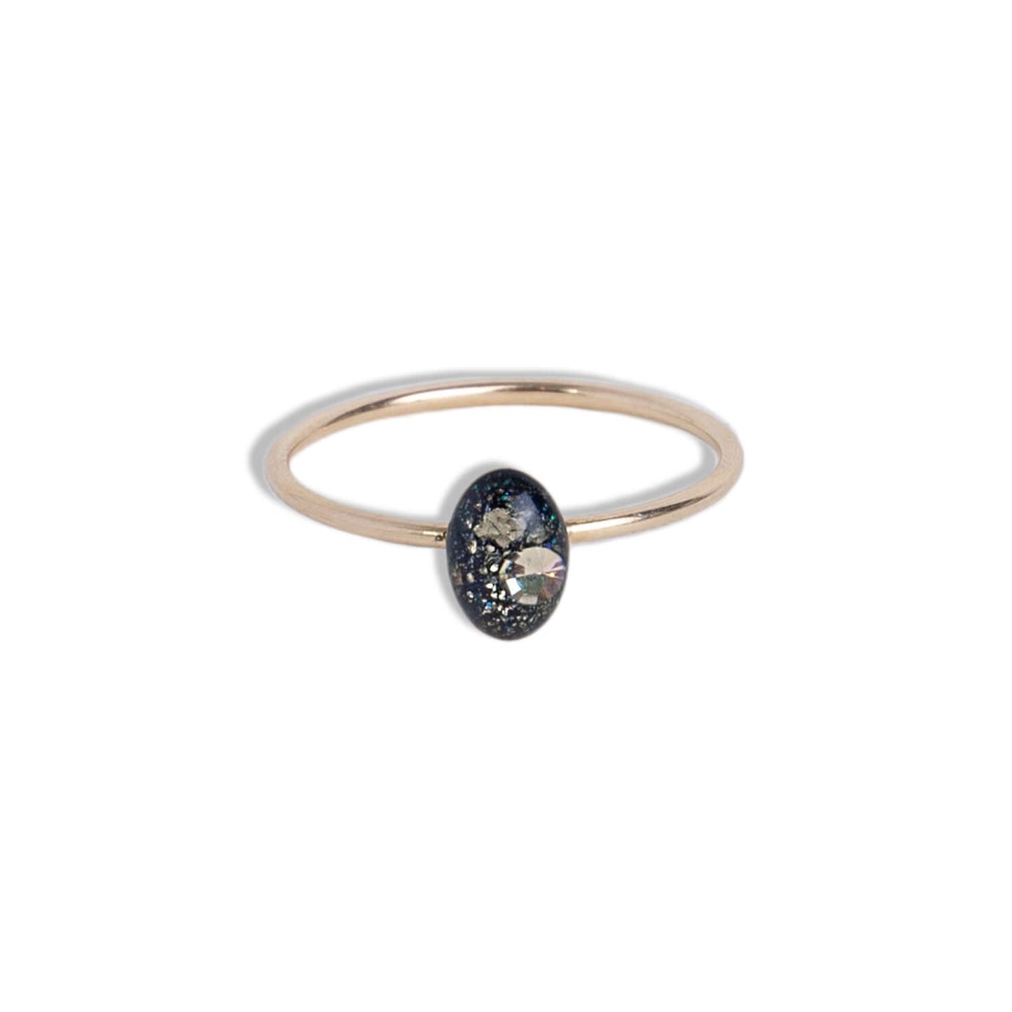 Delicate Tiny Oval Galaxy ring with crushed stones inspired by the pure and authentic energy of the universe — hypnotizing night-sky beauty that sets the mind free to discover all mysteries of the soul. This ring features glass-like crystal with crushed Pyrite stone, Swarovski crystals and pigments inside.