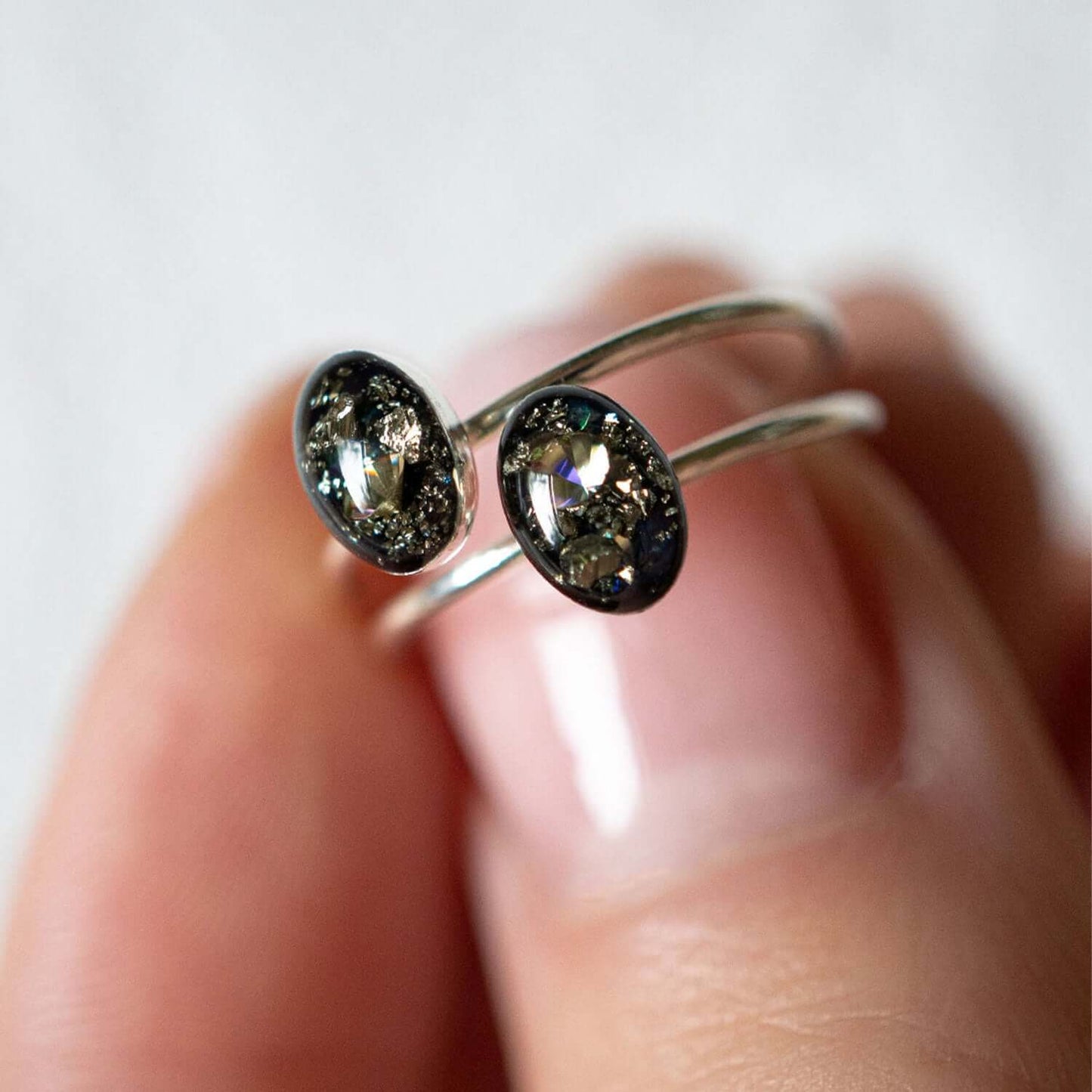 Delicate Tiny Oval Galaxy ring with crushed stones inspired by the pure and authentic energy of the universe — hypnotizing night-sky beauty that sets the mind free to discover all mysteries of the soul. This ring features glass-like crystal with crushed Pyrite stone, Swarovski crystals and pigments inside.