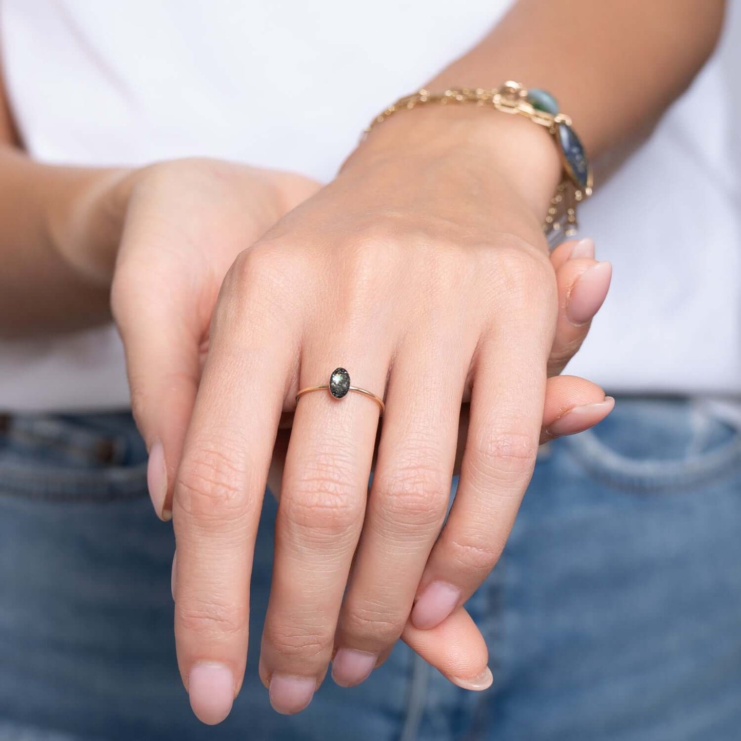 Delicate Tiny Oval Galaxy ring with crushed stones inspired by the pure and authentic energy of the universe — hypnotizing night-sky beauty that sets the mind free to discover all mysteries of the soul. This ring features glass-like crystal with crushed Pyrite stone, Swarovski crystals and pigments inside.
