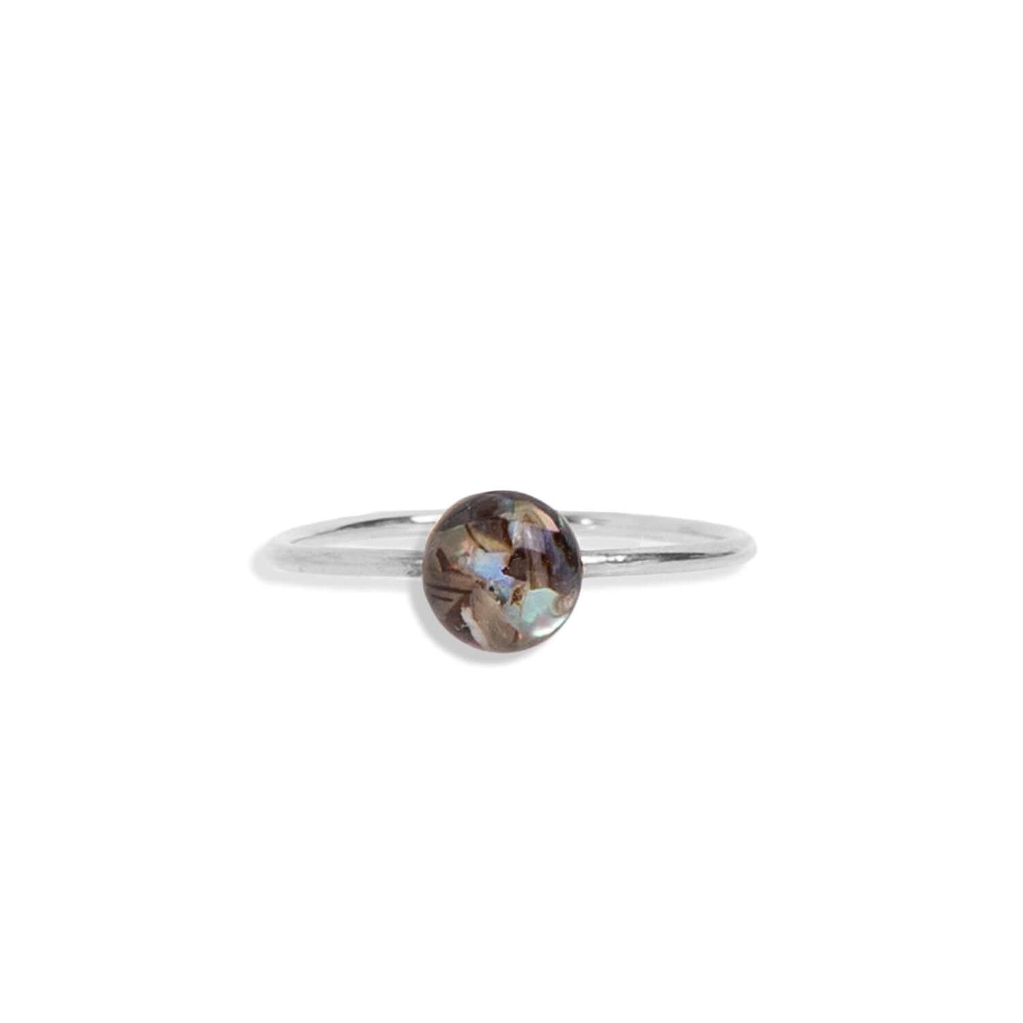 Tiny Abalone Ring is a delicate treasure. Each ring feature a glass-like resin crystal encapsulating Abalone shell chips, radiating an ever-changing array of colors that dance and shimmer with every turn.