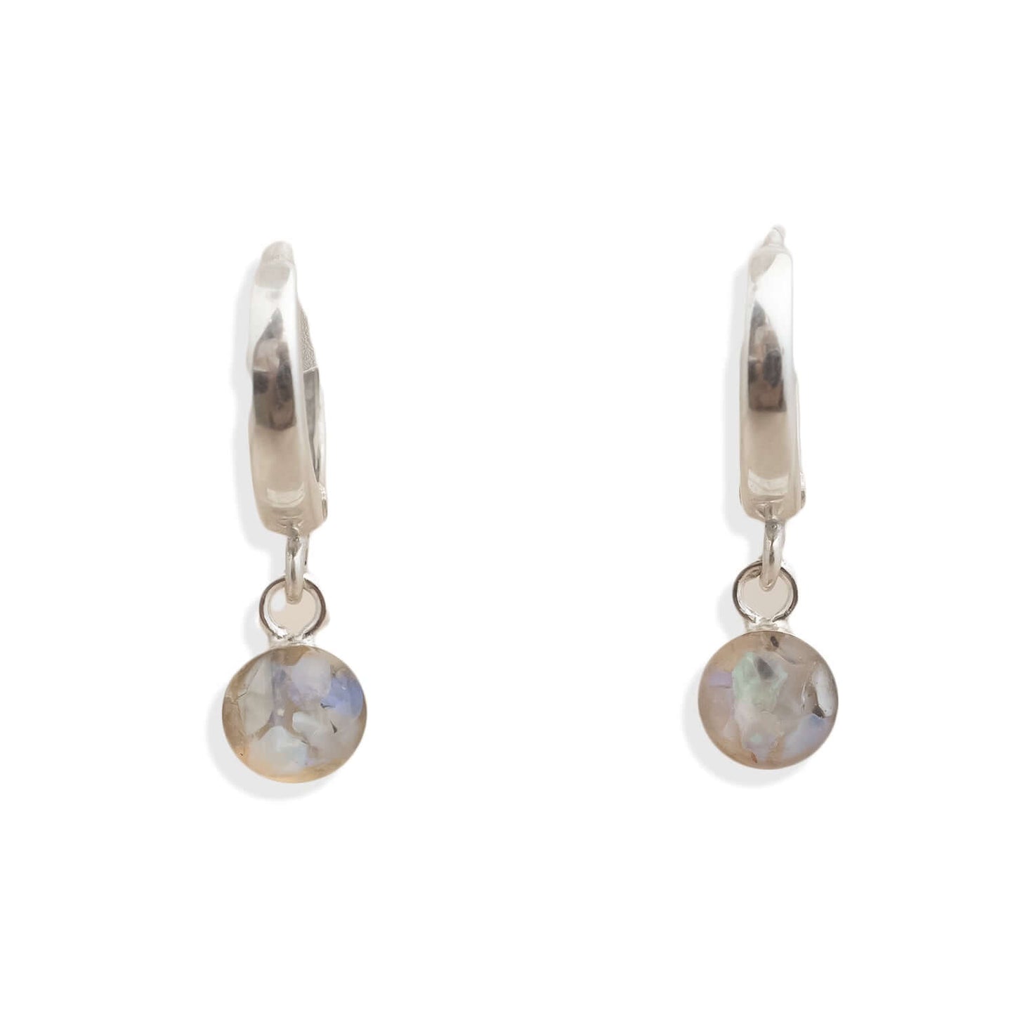 Pair of silver hoop earrings with round gemstones on a white background