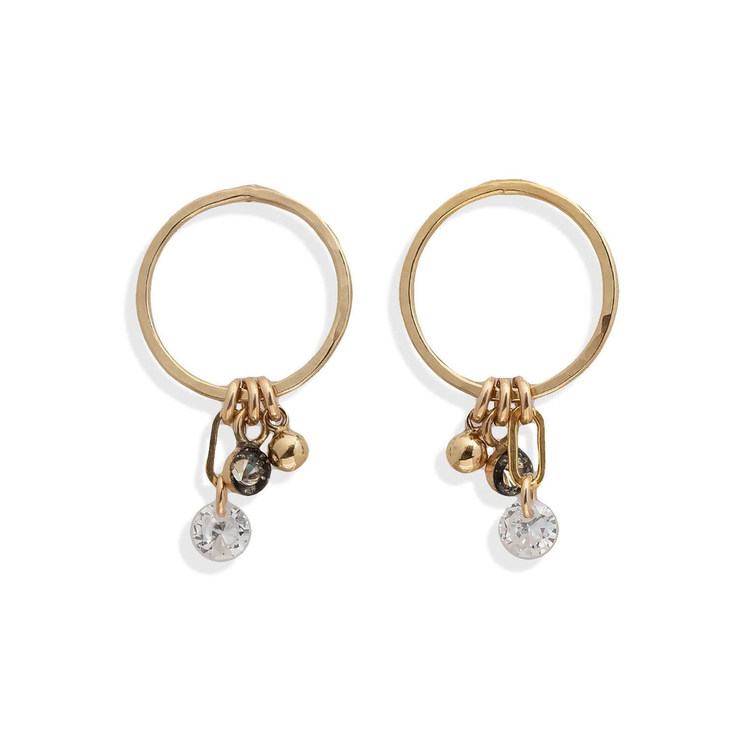 Pair of gold hoop earrings with small charms on a white background