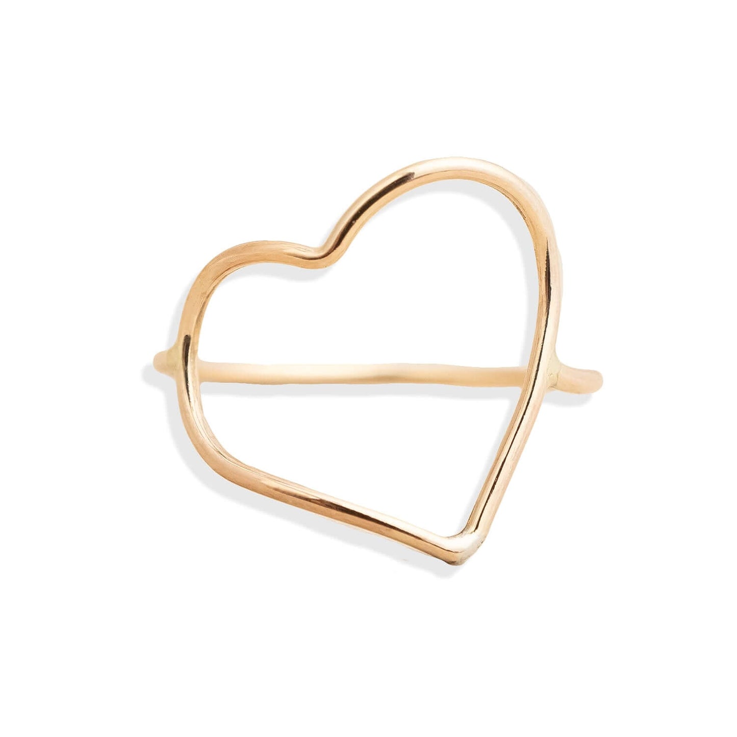 Gold heart-shaped ring on a white background