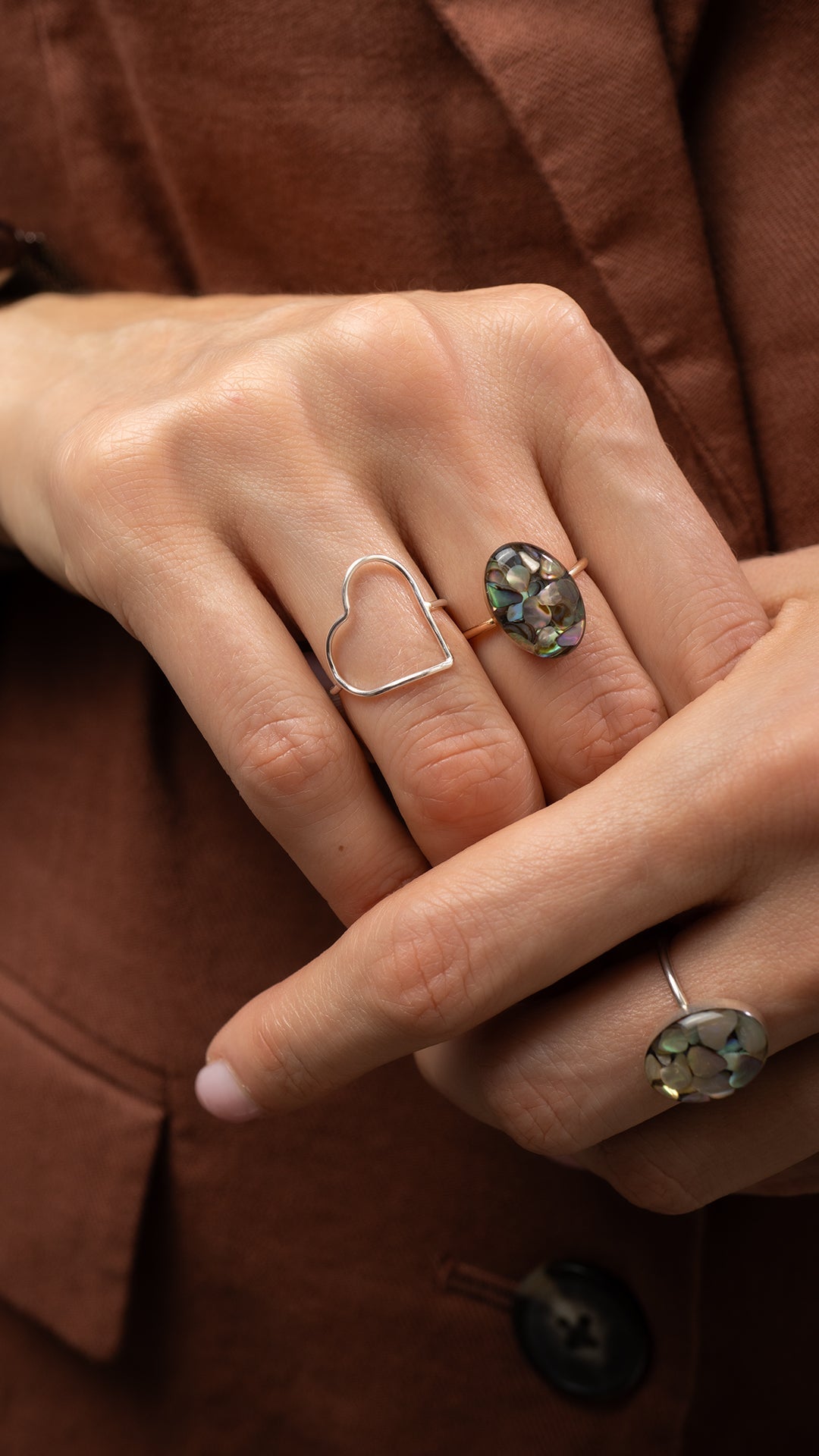 statement Oval Abalone shell rings on a model