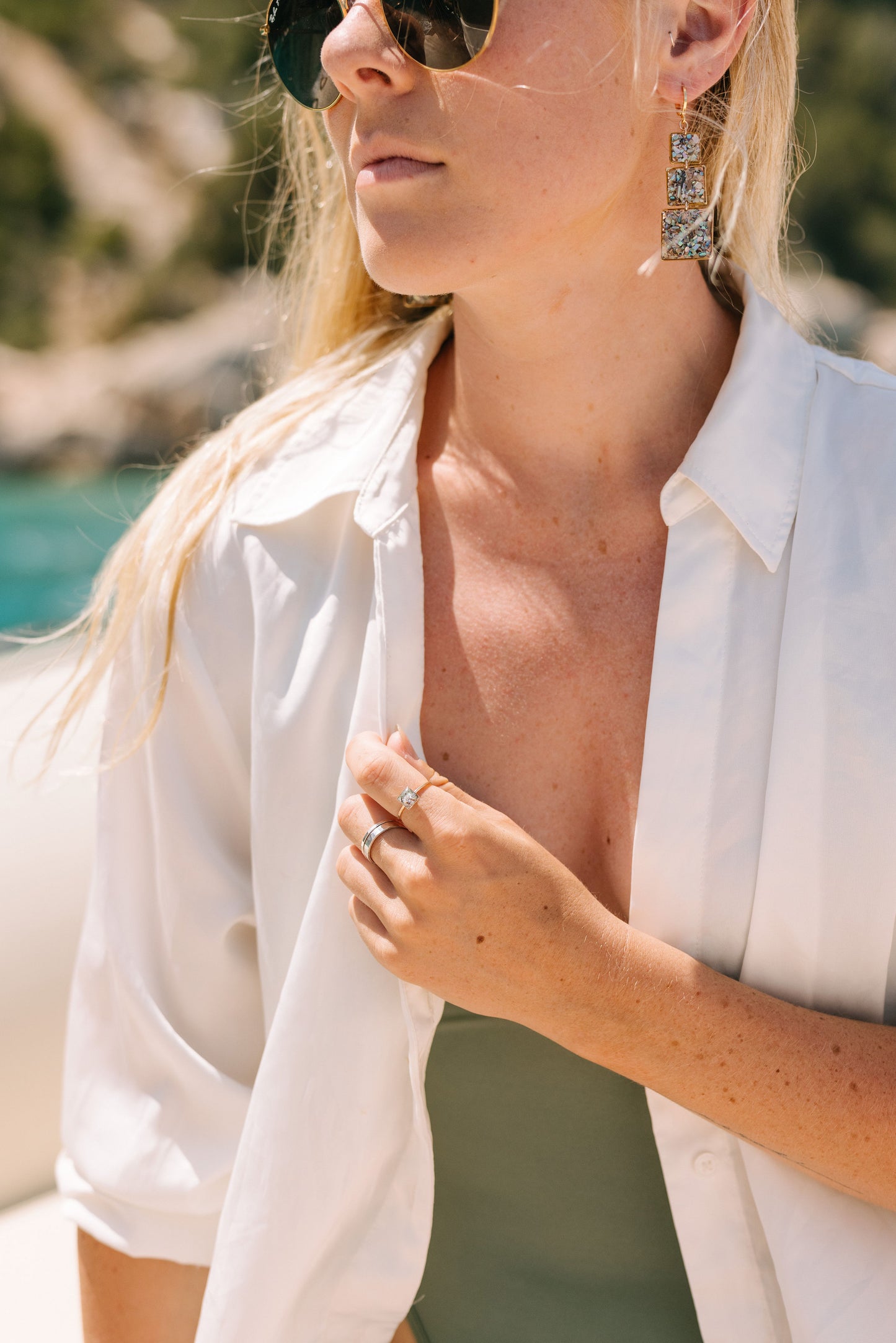 Woman wearing a white shirt with a blurred natural background