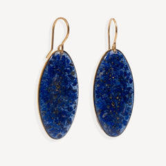 A pair of gold-tone drop earrings with oval blue agate pendants, shown against a plain off-white background.