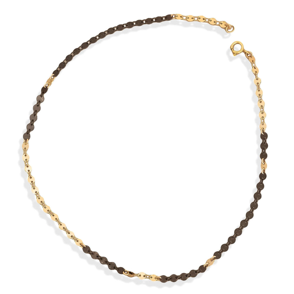 
                      
                        Necklace with alternating brown and gold beads on a white background
                      
                    