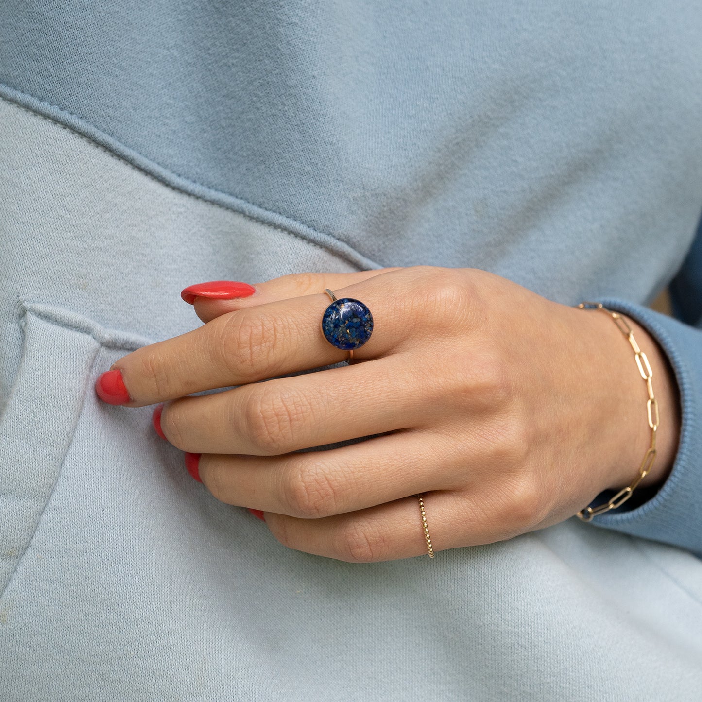 
                  
                    Deep navy blue statement adorable rings with tiny real Lapis Lazuli stone pieces captured in glass like resin in a 12mm round shape.
                  
                