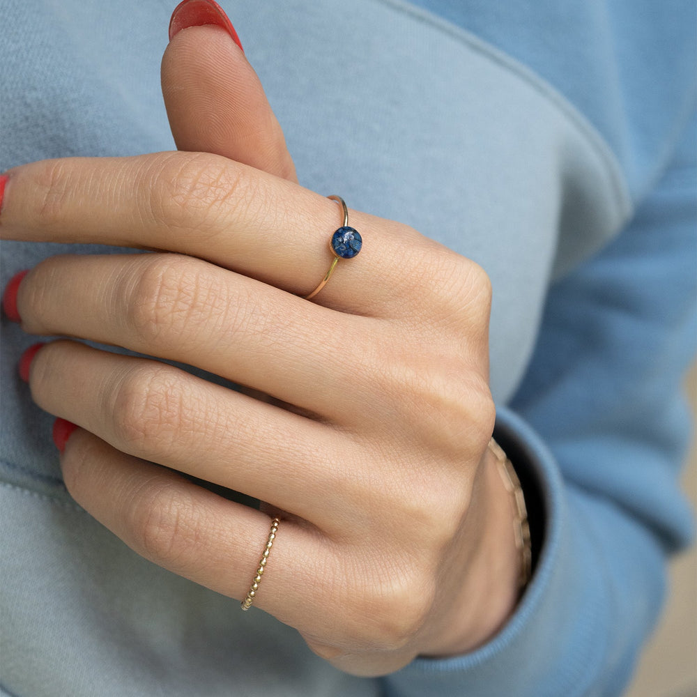 
                  
                    Dainty adorable rings with tiny real Lapis Lazuli stone pieces captured in glass like resin.
                  
                