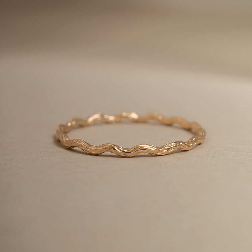 
                      
                        Gold ring on a beige background
                      
                    