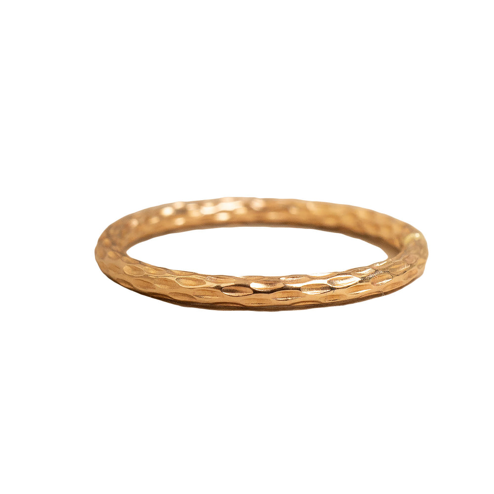
                      
                        Gold ring with a textured band on a white background
                      
                    