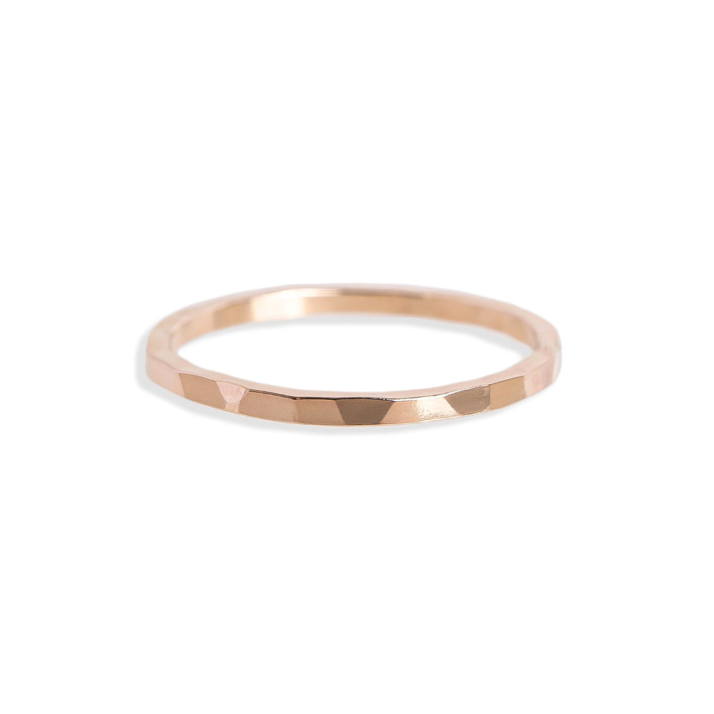 
                      
                        Rose gold ring on a white background
                      
                    