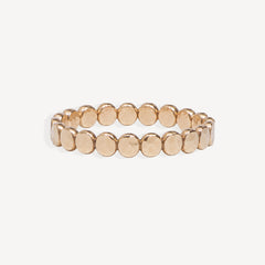 A gold beaded textured dot ring, shown against a plain off-white background.