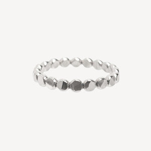 Silver bracelet with heart and diamond details on a white background