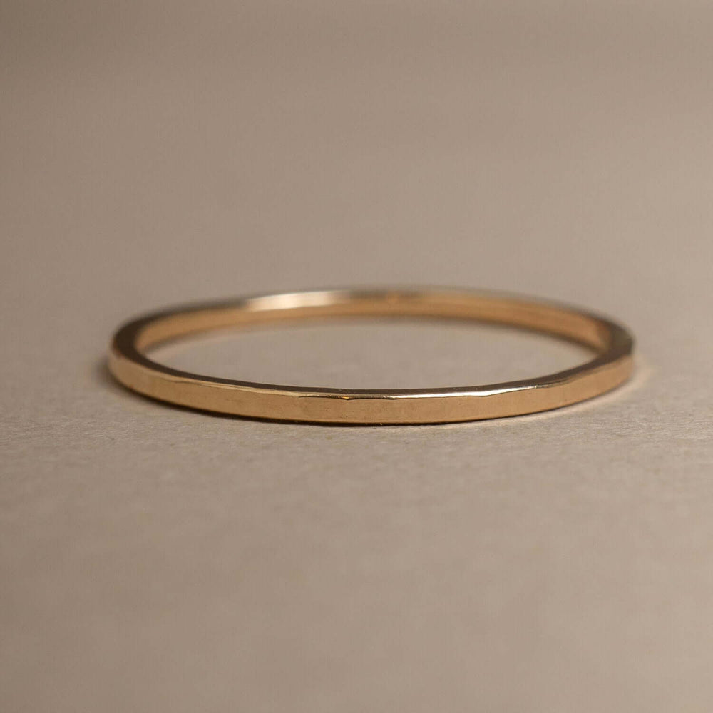 
                      
                        Gold ring on a beige background
                      
                    