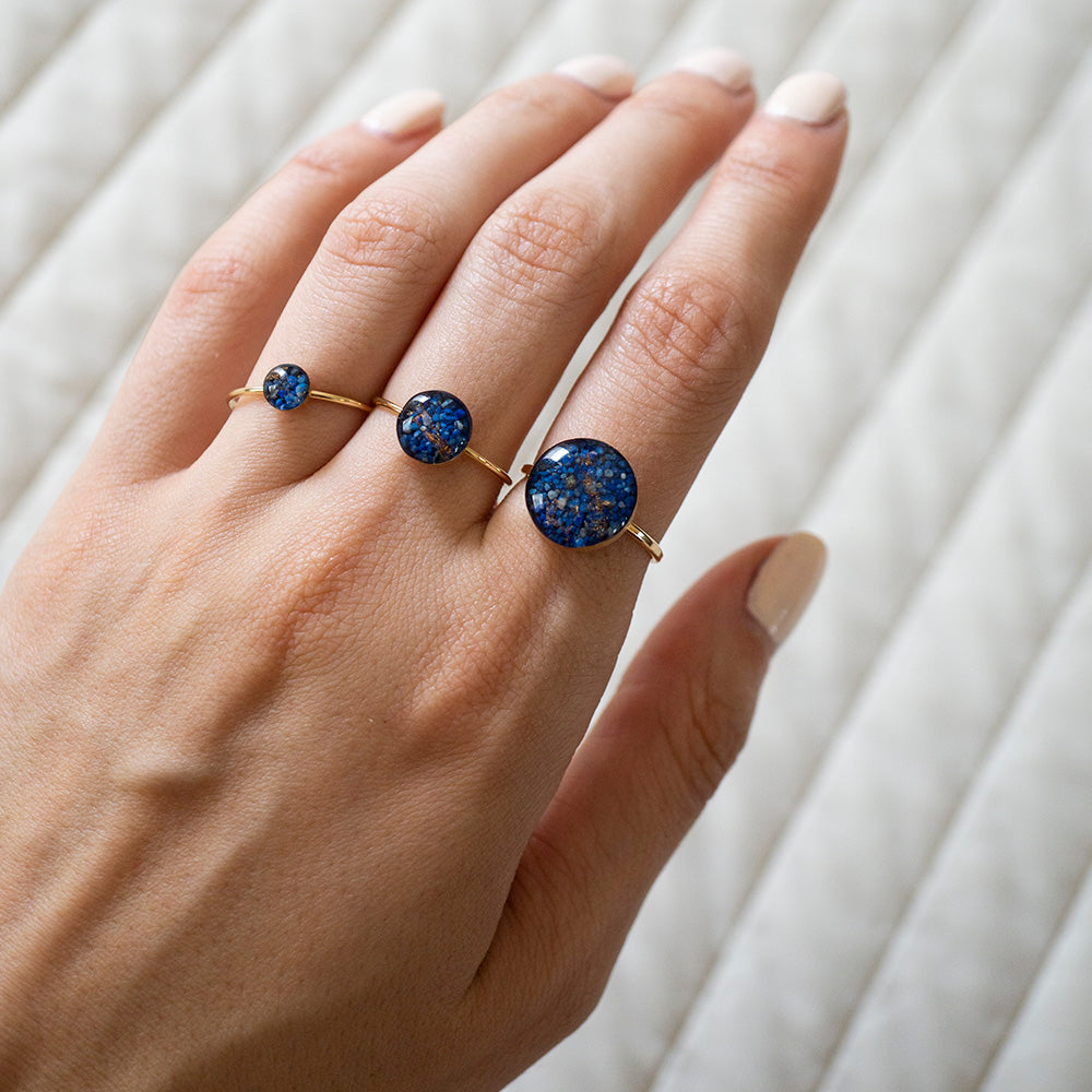 
                      
                        Dainty adorable rings with tiny real Lapis Lazuli stone pieces captured in glass like resin in a 8mm round shape. 
                      
                    