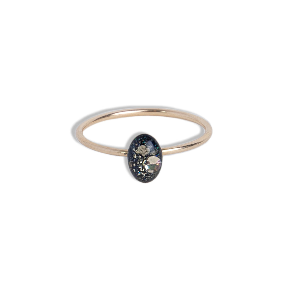 
                  
                    Delicate Tiny Oval Galaxy ring with crushed stones inspired by the pure and authentic energy of the universe — hypnotizing night-sky beauty that sets the mind free to discover all mysteries of the soul. This ring features glass-like crystal with crushed Pyrite stone, Swarovski crystals and pigments inside.
                  
                