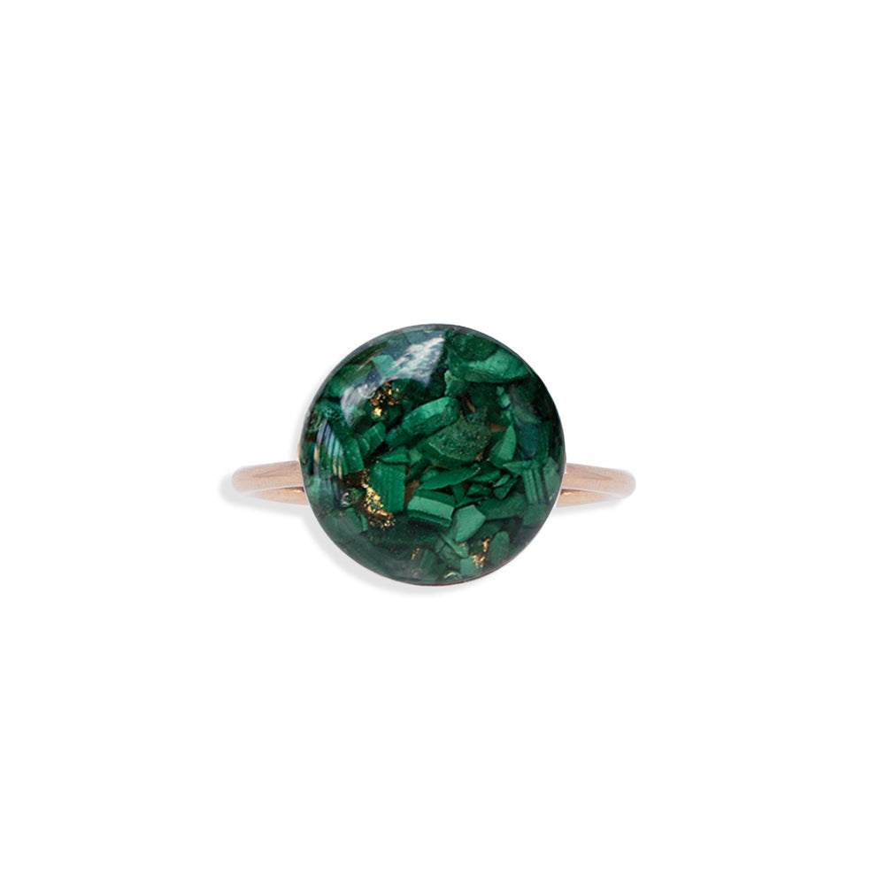 
                  
                    Bright Green ring has crushed Malachite stone pieces captured in glass like resin in a 12mm round shape. Bright natural green ring is a perfect compliment to your everyday style. Beautiful by itself or in a stack. 
                  
                