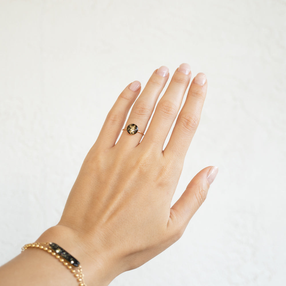 
                  
                    Black and Gold Round Ring
                  
                