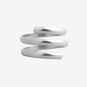 A polished silver spiral wrap ring on a light gray background.
