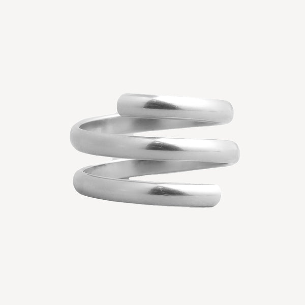 A polished silver spiral wrap ring on a light gray background.