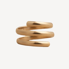 Gold spiral ring on a white background
