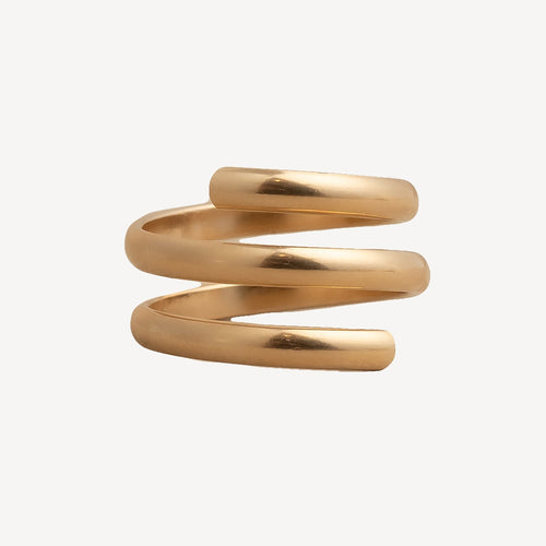Gold spiral ring on a white background