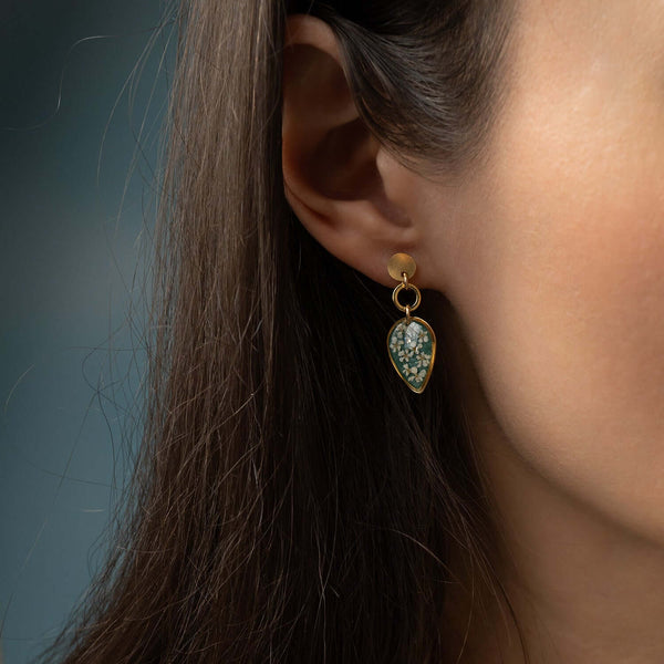 Handcrafted dangling flower earrings with delicate petal details in gold-filled metal by Kate Koel
