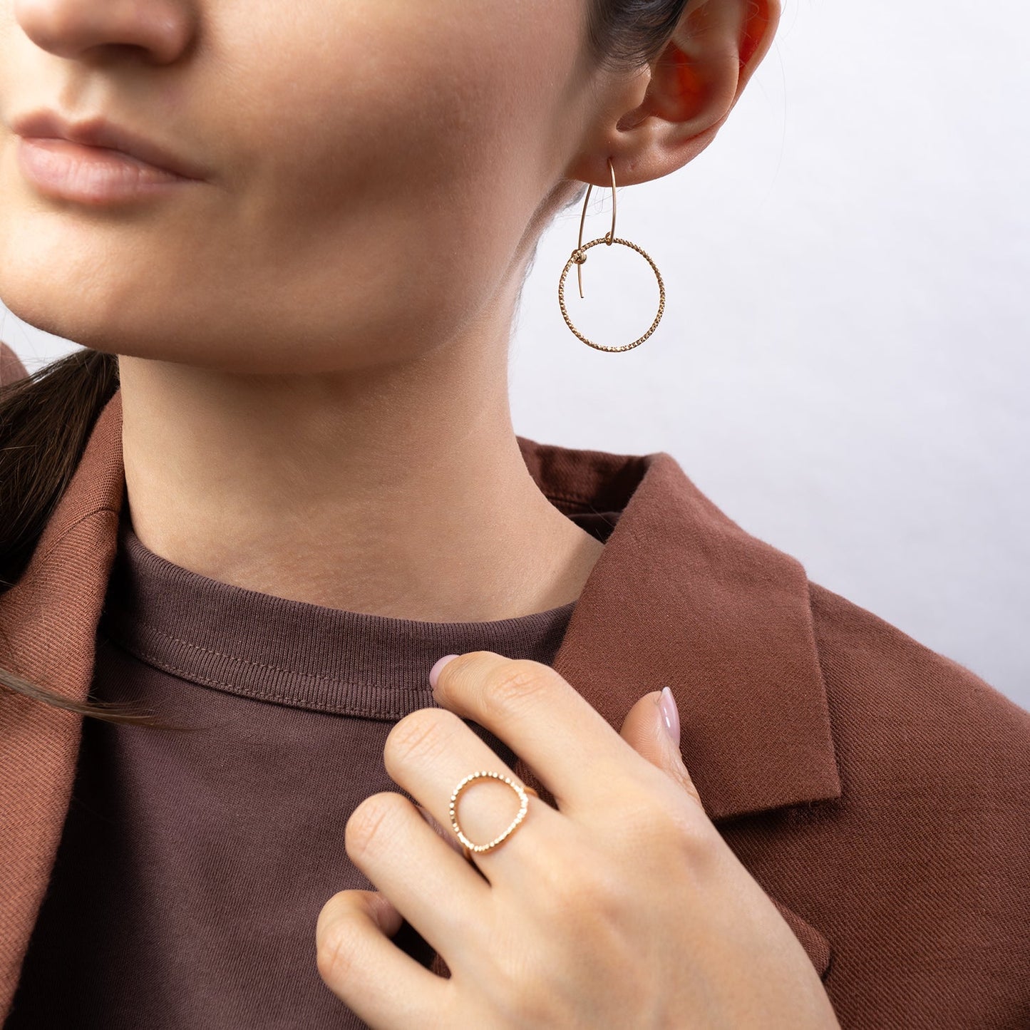 Handcrafted gold-filled disco hoop dangle earrings with textured reflective surface by Kate Koel