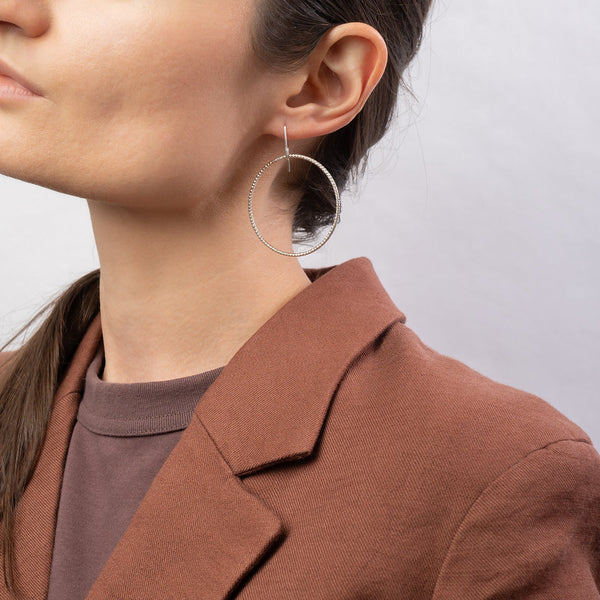 Handcrafted 45mm textured gold-filled disco statement hoop earrings with light-catching sparkle by Kate Koel