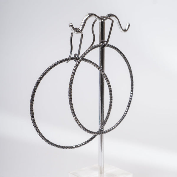 Handcrafted 45mm textured gold-filled disco statement hoop earrings with light-catching sparkle by Kate Koel