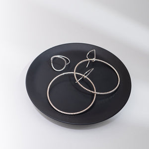 Handcrafted 45mm textured gold-filled disco statement hoop earrings with light-catching sparkle by Kate Koel