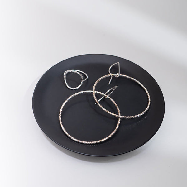 Handcrafted 45mm textured gold-filled disco statement hoop earrings with light-catching sparkle by Kate Koel