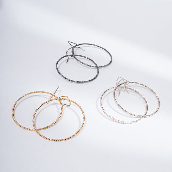 Handcrafted 45mm textured gold-filled disco statement hoop earrings with light-catching sparkle by Kate Koel