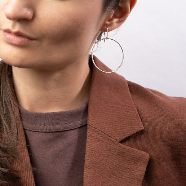 Handcrafted 45mm textured gold-filled disco statement hoop earrings with light-catching sparkle by Kate Koel