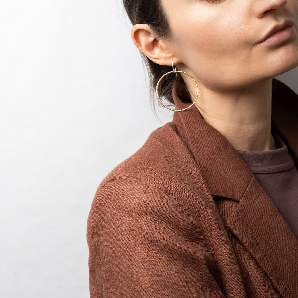 Handcrafted 45mm textured gold-filled disco statement hoop earrings with light-catching sparkle by Kate Koel
