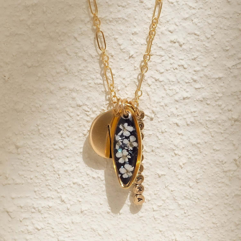 Customizable 14k gold filled floral charm necklace
with pressed flower pendant and hand-stamped initial
charm