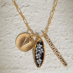 Customizable 14k gold filled floral charm necklace
with pressed flower pendant and hand-stamped initial
charm