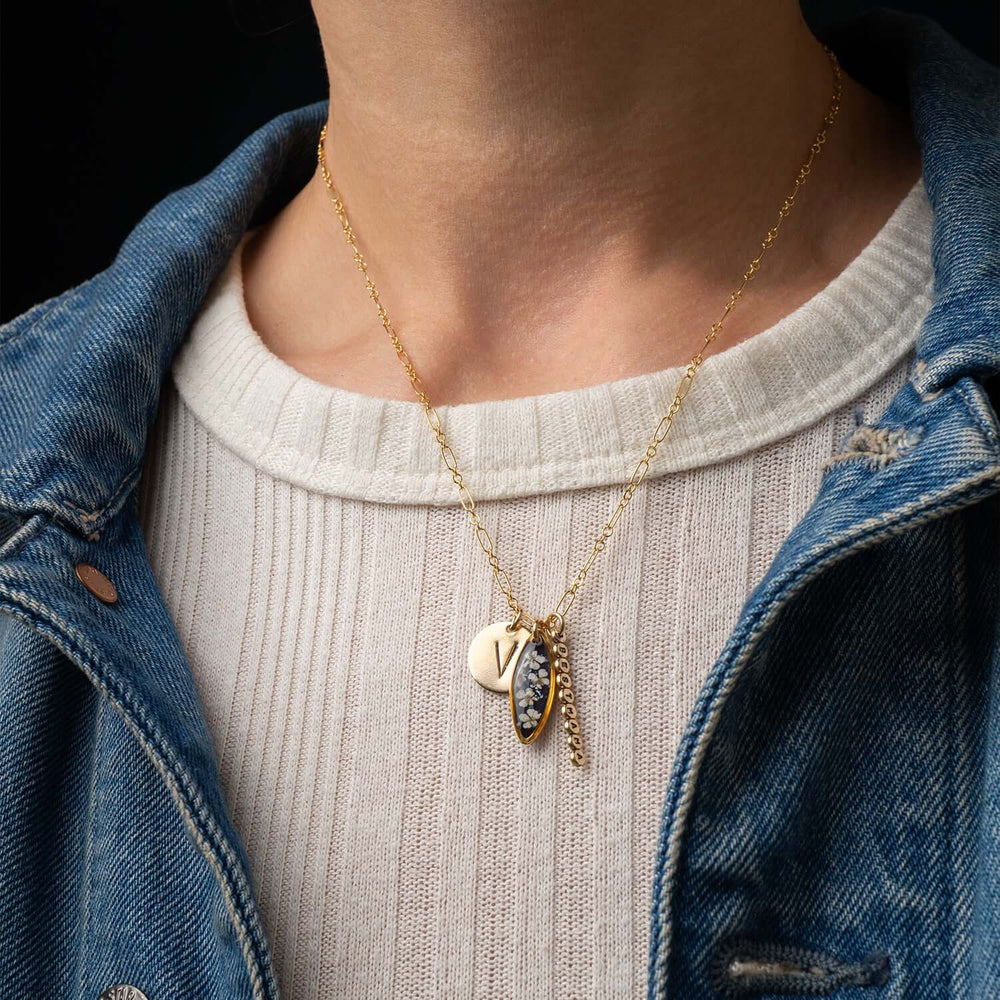 Customizable 14k gold filled floral charm necklace
with pressed flower pendant and hand-stamped initial
charm
