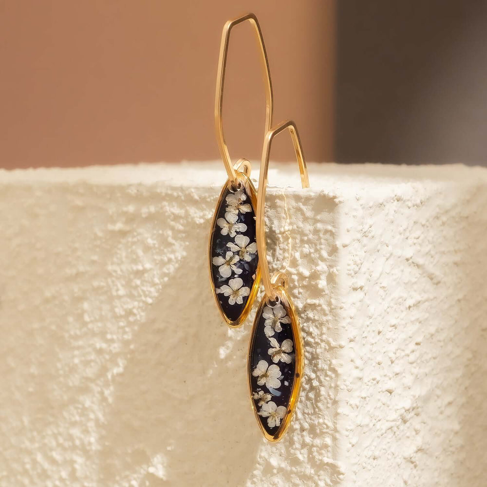 Handcrafted floral oval drop earrings with hand-applied flower design in gold-filled settings by Kate Koel