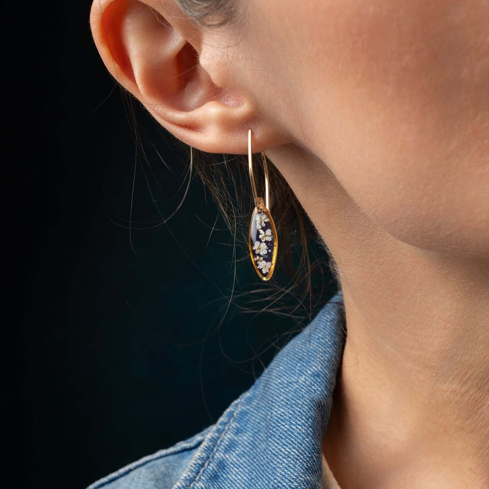 Handcrafted floral oval drop earrings with hand-applied flower design in gold-filled settings by Kate Koel