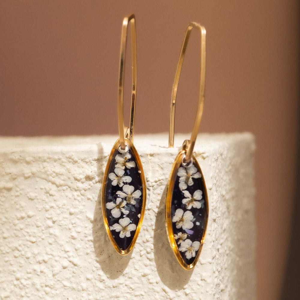 Handcrafted floral oval drop earrings with hand-applied flower design in gold-filled settings by Kate Koel