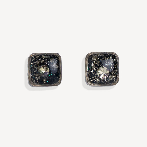 Pair of square stud earrings with gemstones on a white background
