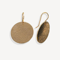 Pair of gold earrings on a white background