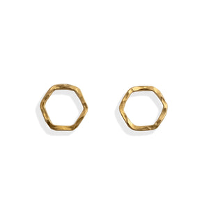 Gold hexagonal earrings on a white background