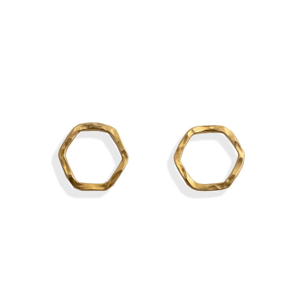 Gold hexagonal earrings on a white background