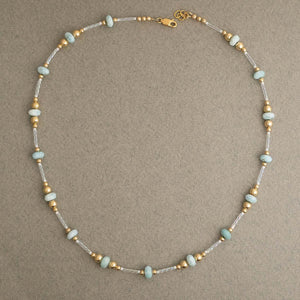 Handcrafted Larimar Gold Beaded Necklace with Caribbean blue stones by Kate Koel